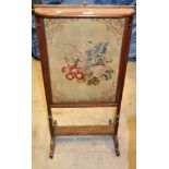 A mahogany rectangular fire screen, adjustable needlework panel, c.