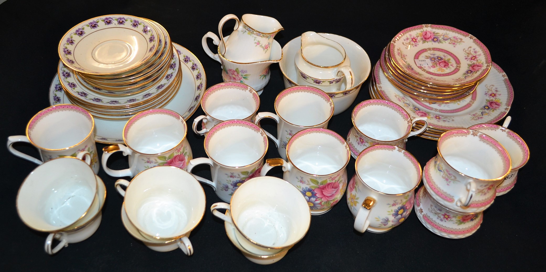 A Queens china Richmond pattern tea service; similar mugs; a Pansy pattern tea service;