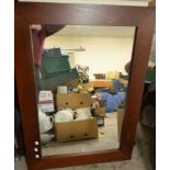 A large 'mahogany' framed rectangular mirror,