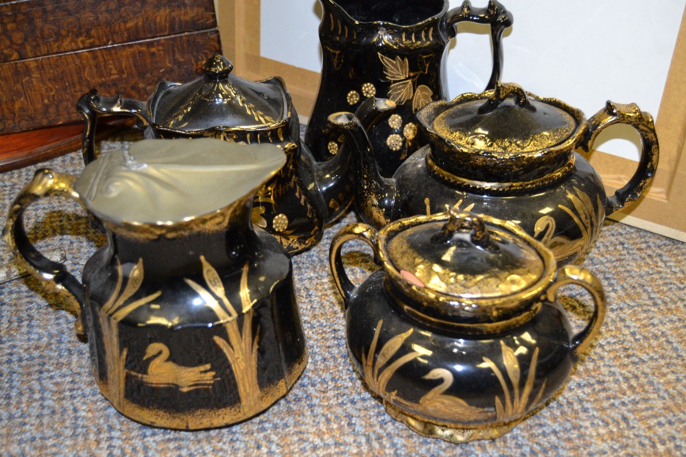 A late Victorian 'Jackfield' type three piece tea service,