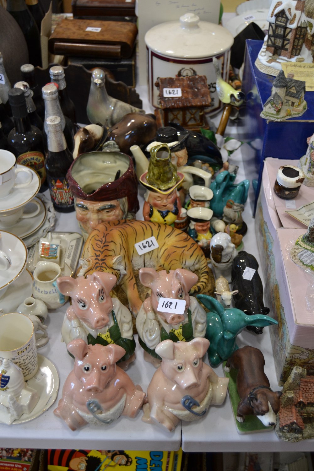Ceramics - a set of Wade Natwest pigs; Poole dolphin; a Royal Doulton character dog;