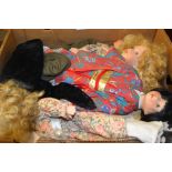A 20th century porcelain headed doll, dressed in a Japanese kimono, black dressed hair; another,