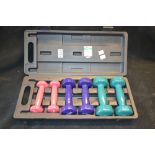 A set of three lady's work-out dumb bells, graduated weight,