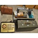 A sewing machine, cased; another; two typewriters,
