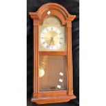 An arched wall clock,