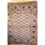 A woollen rug in tones, 50" x 62" **All lots in this sale are subject to a maximum of £2.