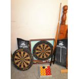 A Winmau dartboard; another,