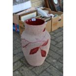 A large baluster vase, incised with blossoming flowers,