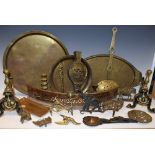 Brassware including chestnut roaster, hammered tray, andirons, pagoda, candlesticks, trivets,