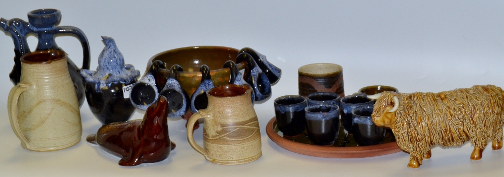Studio Stoneware - a Highland cow; Studio pottery jugs; a ewer and six blue glazed beakers;
