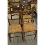 A pair of rush-seated side chairs; another pair,
