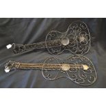 A wrought iron fretwork model of a classical guitar;