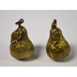 A pair of silver bark textured charms, as pears,
