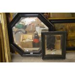 A 20th century octagonal ebonised mirror;