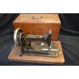A Frister Rossmann sewing machine, cased,