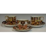 A Royal Crown Derby 2451 pattern cup and saucer; another similar;