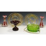 A pair of Bohemian flash cut and enamelled candle sticks; a cut ruby glass urn;