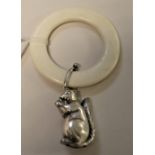 A silver baby rattle modelled as a squirrel,