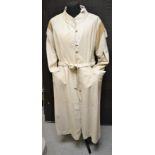 A full length lady's leather coat, pale cream, 1970's, belted, mandarin collar,