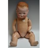 An early 20th century Armand Marseille bisque headed baby doll, sleeping eyes, open mouth,