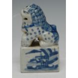 A Chinese porcelain seal, modelled with a seated guardian lion,