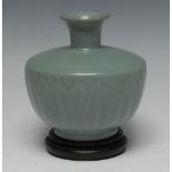 A Chinese Longquan celadon ovoid lotus vase, moulded in relief with a frieze of stepped leaves,