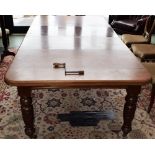 A late Victorian/Edwardian mahogany extending dining table, rounded rectangular moulded top,