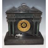 A French slate and marble clock, striking on a bell,