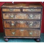 A 19th century walnut chest of two smart over three long graduated drawers,