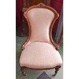 A late Victorian nursing chair, turned legs, reupholstered,