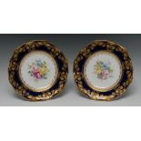 A fine pair of Royal Crown Derby shaped circular plates, painted by Cuthbert Gresley,
