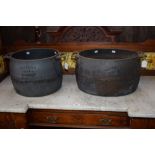 An early 20th century Holcroft 48 pint cast iron cooking vessel; another 40 pint,