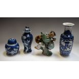 A Chinese blue and white 'Prunus' vase and cover,