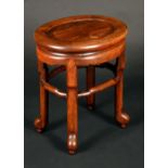 A Chinese huanghuali hardwood oval low table or jardiniere stand, panelled top, shaped stretcher,