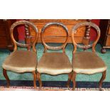 A set of six Victorian walnut dining chairs, c.