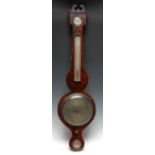 A George III mahogany wheel barometer, 20cm silvered register, alcohol thermometer, hygrometer,