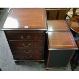 A mahogany effect stereo cabinet with four faux drawer door;