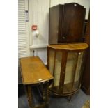 An Art Deco walnut display cabinet, demi lune,