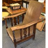 Early 20th century Oak recliner arm chair, with extendable foot rest.