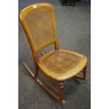 A Victorian Bergere rocking chair,