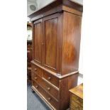 A Victorian flame mahogany linen press,two doors enclosing slides,