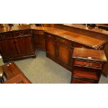 A reproduction mahogany sideboard three short drawers over three door cupboard;