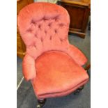 A Victorian mahogany button back nursing chair, turned forelegs, ceramic casters.