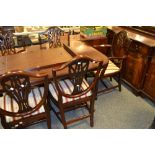 A reproduction Regency mahogany dining room suite comprising extending dining table, four chairs,
