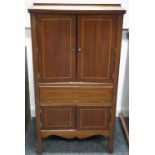 An Edwardian mahogany free standing centre cupboard,