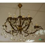 A six branch, twelve light gilt metal and cut glass chandelier.