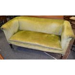 An Arts & Crafts settee, high back, scrolled arms,
