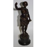 A bronze figure of a maiden on a green marble base