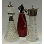 A claret jug with plated mounts; a confirming decanter;