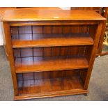 An oak floor standing bookcase, moulded top, adjustable shelving, 97cm high x 91cm wide x 28.